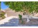Charming home featuring a neutral stucco facade, a two-car garage, and well-maintained desert landscaping at 2729 N Kenton St, Mesa, AZ 85215