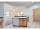Kitchen sink, dishwasher, and cabinets, with an open view to the living and entryway at 2729 N Kenton St, Mesa, AZ 85215