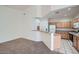 Cozy living room showcasing an open layout with a partial wall to the adjacent kitchen at 2729 N Kenton St, Mesa, AZ 85215