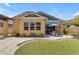 Well-maintained backyard with a putting green, patio, mature plants and trees at 3058 E Spring Wheat Ln, Gilbert, AZ 85296