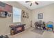 Bright bedroom with window, desk, and décor; perfect for a home office at 3058 E Spring Wheat Ln, Gilbert, AZ 85296