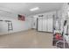 Spacious garage featuring epoxy floors and ample storage cabinets at 3058 E Spring Wheat Ln, Gilbert, AZ 85296