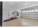 Clean and spacious garage with epoxy flooring and ample storage solutions at 3058 E Spring Wheat Ln, Gilbert, AZ 85296