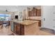 Open concept kitchen with a large island, granite countertops, and dark wood cabinetry at 3058 E Spring Wheat Ln, Gilbert, AZ 85296