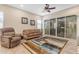 Inviting living room with a ceiling fan and access to an outdoor patio area at 3058 E Spring Wheat Ln, Gilbert, AZ 85296