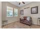 Inviting living room with a cozy sofa, natural light, and a tile floor at 3058 E Spring Wheat Ln, Gilbert, AZ 85296