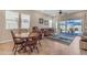 Bright living room with tile floors, comfy seating, and sliding doors to the backyard at 3058 E Spring Wheat Ln, Gilbert, AZ 85296