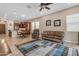 Open-concept living area with a dining table, comfortable seating, and tile flooring at 3058 E Spring Wheat Ln, Gilbert, AZ 85296