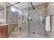 Luxurious walk-in shower with sleek glass and elegant tile work at 3058 E Spring Wheat Ln, Gilbert, AZ 85296
