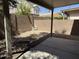 A view of the backyard from under the patio with block wall and desert landscaping at 3428 E Renee Dr, Phoenix, AZ 85050