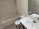 Bathroom with a bathtub and shower, toilet, sink, and mirror above the sink at 3428 E Renee Dr, Phoenix, AZ 85050