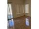 Empty bedroom with large windows and sliding glass door with view to the exterior at 3428 E Renee Dr, Phoenix, AZ 85050