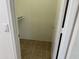 Walk-in closet with tile flooring and shelf storage at 3428 E Renee Dr, Phoenix, AZ 85050
