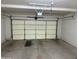 Spacious garage featuring a white door, ample room for storage, and cement flooring at 3428 E Renee Dr, Phoenix, AZ 85050