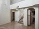 Bright open living room with tall ceilings and a staircase at 3428 E Renee Dr, Phoenix, AZ 85050