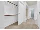 Hallway with a large closet and full bathroom that offers a soaking tub and glass-enclosed shower at 3855 W Denver St, Chandler, AZ 85226