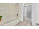 Well-lit bathroom showcasing a soaking tub and a glass-enclosed shower for a spa-like experience at 3855 W Denver St, Chandler, AZ 85226