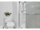 Bathroom featuring a toilet and a stand-up shower with glass door at 3855 W Denver St, Chandler, AZ 85226