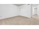 This bedroom features neutral carpet, a closet, and an entry to the hall at 3855 W Denver St, Chandler, AZ 85226