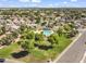 Aerial view of the community pool, lush landscaping, and surrounding neighborhood at 3855 W Denver St, Chandler, AZ 85226