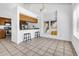 Sunlit kitchen with ample counter space, updated appliances, and seating area at 3855 W Denver St, Chandler, AZ 85226