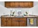 Kitchen featuring stainless steel appliances, wooden cabinets, and plenty of counter space at 3855 W Denver St, Chandler, AZ 85226