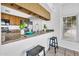 Kitchen bar with a stainless-steel sink, plenty of counter space and seating for casual dining at 3855 W Denver St, Chandler, AZ 85226