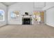 Inviting living room featuring a classic fireplace and sliding door access to the backyard at 3855 W Denver St, Chandler, AZ 85226
