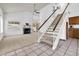 Bright living room with vaulted ceiling, fireplace and staircase, and great natural light at 3855 W Denver St, Chandler, AZ 85226