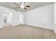 A spacious main bedroom featuring plush carpeting and an en suite bathroom at 3855 W Denver St, Chandler, AZ 85226