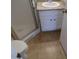 This bathroom features tile floors, a shower, and a sink with granite countertop and white cabinets at 413 E Bruce Ave # D, Gilbert, AZ 85234