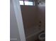 Bathroom featuring tub and shower combo with window for natural light at 413 E Bruce Ave # D, Gilbert, AZ 85234