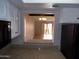 Open kitchen view to living area with pass-through and granite counters at 413 E Bruce Ave # D, Gilbert, AZ 85234