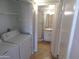 Laundry room with tile floors, washer and dryer, access to bathroom at 413 E Bruce Ave # D, Gilbert, AZ 85234