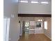 Bright, open living room with high ceilings and tiled floors; open layout to the kitchen area at 413 E Bruce Ave # D, Gilbert, AZ 85234