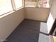 Enclosed patio featuring gray carpet, wood paneled walls, and a view of an outdoor area at 413 E Bruce Ave # D, Gilbert, AZ 85234