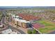 Aerial view showing the condo community including tennis courts, pool and surrounding area at 453 S Parkcrest -- # 416, Mesa, AZ 85206