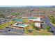 Expansive aerial view of a community featuring a pool, clubhouse, tennis courts and plentiful parking at 453 S Parkcrest -- # 416, Mesa, AZ 85206