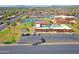 Aerial view of the community clubhouse with tennis courts, a pool and parking at 453 S Parkcrest -- # 416, Mesa, AZ 85206