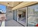 Balcony that leads into a cozy living room with a rocking chair, fireplace, and rug at 453 S Parkcrest -- # 416, Mesa, AZ 85206