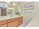 Neutral-toned bathroom with a large mirror, vanity, and tile floor at 453 S Parkcrest -- # 416, Mesa, AZ 85206