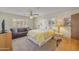 Comfortable bedroom with a sofa, a yellow blanket, and bright natural light streaming through the windows at 453 S Parkcrest -- # 416, Mesa, AZ 85206
