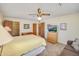 A lovely bedroom with a ceiling fan, carpet floors, closet, and a desk for comfort at 453 S Parkcrest -- # 416, Mesa, AZ 85206