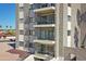 Building featuring rock facade with a series of private balconies on each floor at 453 S Parkcrest -- # 416, Mesa, AZ 85206