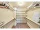 Walk-in closet featuring built-in shelves, carpet, and storage space at 453 S Parkcrest -- # 416, Mesa, AZ 85206