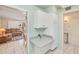 Kitchen with white cabinetry, tile floor, and access to the living room at 453 S Parkcrest -- # 416, Mesa, AZ 85206