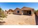 Well maintained backyard with a covered patio and desert landscaping at 4942 W Novak Way, Laveen, AZ 85339