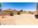A large, empty backyard with a block wall provides privacy at 4942 W Novak Way, Laveen, AZ 85339