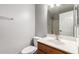 A bathroom featuring a wood vanity and a mirror at 4942 W Novak Way, Laveen, AZ 85339