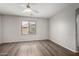 Bright, spacious bedroom featuring a ceiling fan and large window at 4942 W Novak Way, Laveen, AZ 85339